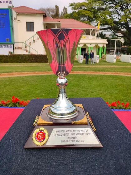 The Maj. C. Newton-Davis Memorial Trophy, a classic fluted silver cup.