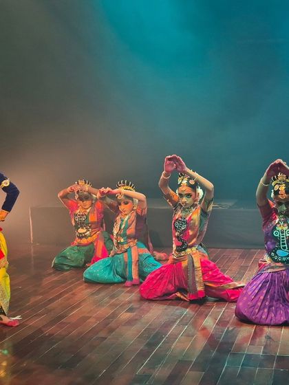Dancers portraying the gopis with Krishna in a scene from our performance at Jagriti Theatre. The vibrant costumes and expressive postures bring the stories you grew up with to life right before your eyes.