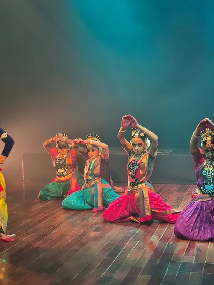 Dancers portraying the gopis with Krishna in a scene from our performance at Jagriti Theatre. The vibrant costumes and expressive postures bring the stories you grew up with to life right before your eyes.