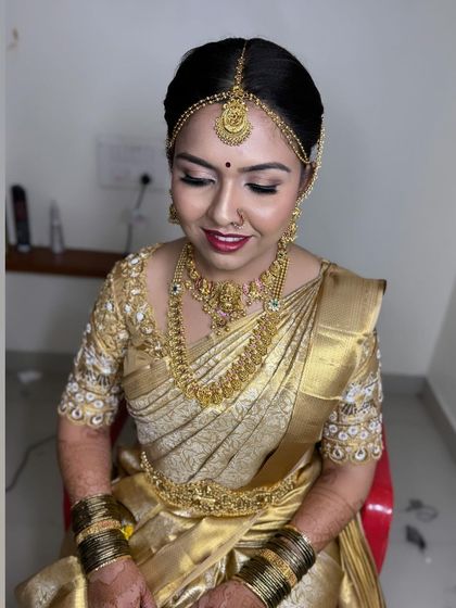 Another shot of this classic golden bride. The makeup is kept timeless to match the traditional attire.