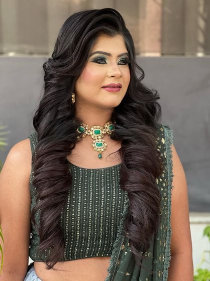 A front view of the finished voluminous curls, framing the face beautifully.