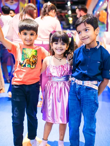 Siblings and friends pose together during our Raksha Bandhan event. I create a festive atmosphere where families can celebrate together and make wonderful memories.