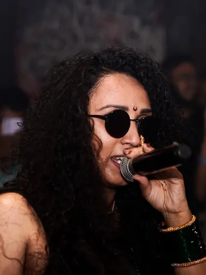 On the mic, connecting with the crowd during a Drum and Bass set. It's about more than just playing music; it's about creating a shared experience.