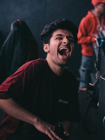 A candid shot of me laughing behind the decks. Even in the middle of a high-energy set, there's always room for joy.