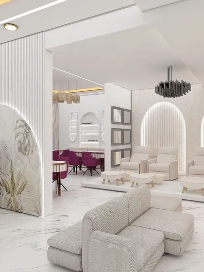 We deliver a high-end salon experience. This is a look at the quality of the interior design and layout you will receive, featuring a spacious reception, comfortable pedicure stations, and a modern aesthetic.