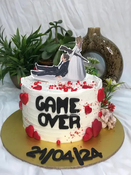 Who says bachelorette cakes can't be elegant and funny? This 'Game Over' cake was so much fun to create, featuring a humorous topper, the wedding date, and red heart details.