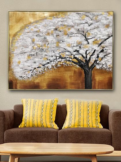 This hand-painted wall art depicts a beautiful tree with white blossoms against a golden, textured background. It's a perfect piece to add a touch of nature-inspired elegance to your living room or bedroom.