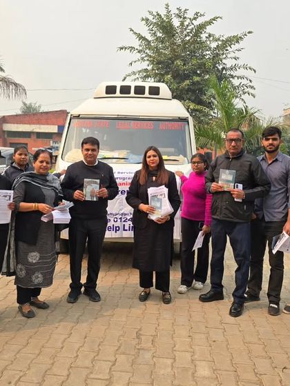 Distributing legal awareness pamphlets to college students. These materials provide essential information that they can take home and share with their families.