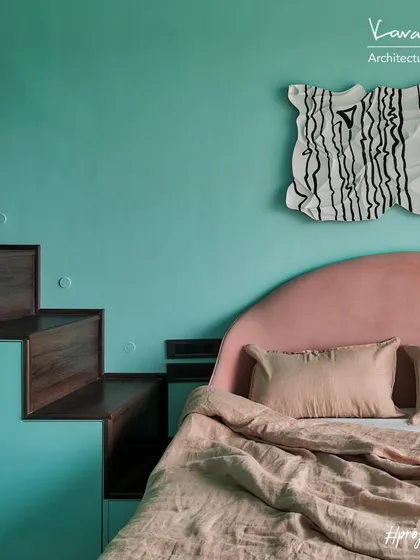 This daughter's room in Project 704 features a custom loft bed designed for sleepovers. It's large enough for six kids and has a secret storage area, plus a portable projector for movie nights.