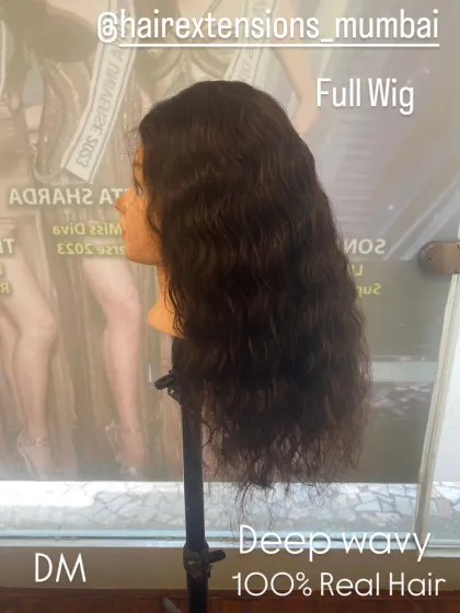 This is a deep wavy full wig, showcasing the different textures we offer. This piece is made from 100% real hair for a natural and voluminous look.