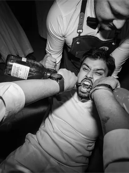 Another wild moment from the party, captured with a high-energy, in-your-face perspective. These are the unfiltered, fun moments that define a great celebration.