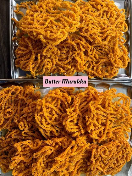 Trays of my crispy and savory Butter Murukku, a classic South Indian snack that I make fresh in my kitchen.