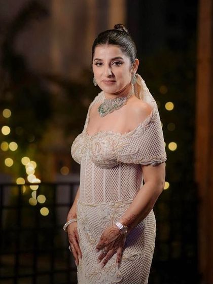 A close-up of my client in the sculpted ivory corset gown, a silhouette that celebrates both form and femininity, softness and strength.