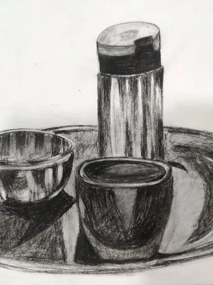 This is a student's finished charcoal sketch of a still life setup. Notice the detailed work on the metallic shine of the steel utensils, a technique we practice in class.