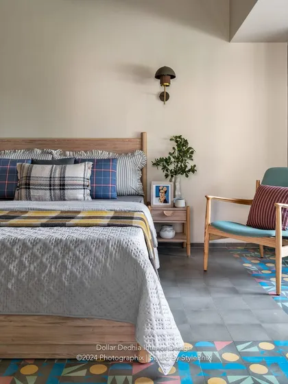 A cozy corner in another bedroom from the Panchgani villa. I mixed plaid and striped cushions for a touch of rustic charm, while the colorful geometric floor tiles add a playful, modern twist.