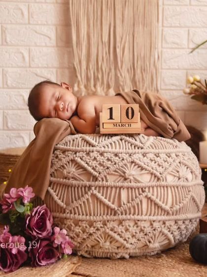We often include milestone markers in our photos. Here, a wooden block calendar marks the baby's date of birth in our lovely boho-themed setup.