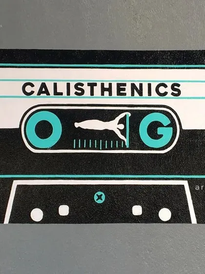 This is a finished graphic we painted for a gym, designed to look like a retro cassette tape. We focus on clean lines and bold visuals to create motivational art for fitness spaces, like this 'Calisthenics OG' piece.
