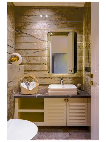 This washroom in our Gurgaon project uses a soothing grey palette and fluted cabinet details. The design is rooted in a neo-classical theme, creating a space that feels calm, graceful, and quietly luxurious.