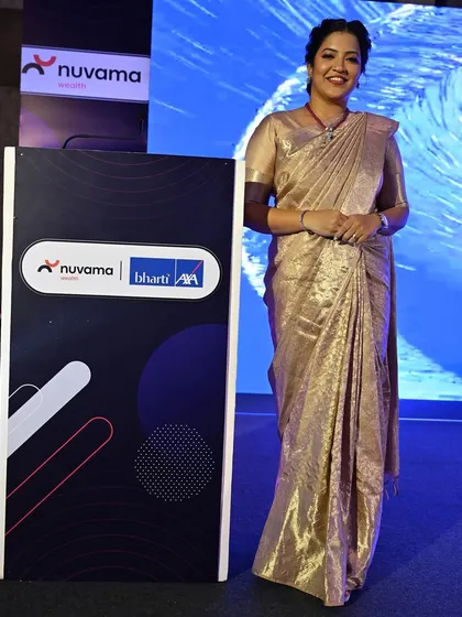Posing by the event branding for the Bharti AXA Life Insurance and Nuvama Wealth partnership launch. I was the emcee for this significant event marking a new chapter for two giants in finance and insurance.