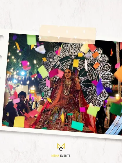 A bride's grand entry on a 'Singhasan' prop, made even more festive with a shower of colorful paper from my confetti blasters. It’s a moment of pure joy and celebration.
