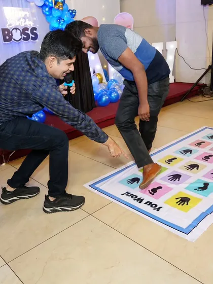 Guiding a player through the mat game. A little encouragement from the emcee can make all the difference.
