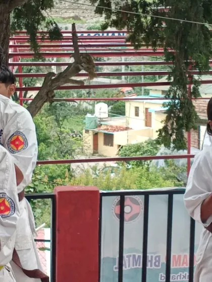 A close-up of my students in their fighting stance, fists clenched and eyes forward. This shows their readiness and concentration during the belt examination.