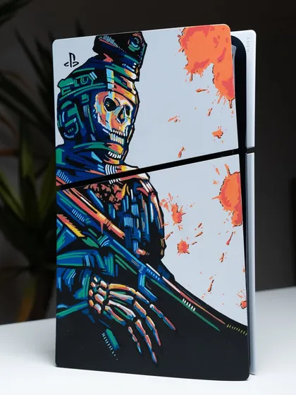 A vibrant, graphic-style skeleton soldier from 'Call of Duty' painted on a PS5 console plate.
