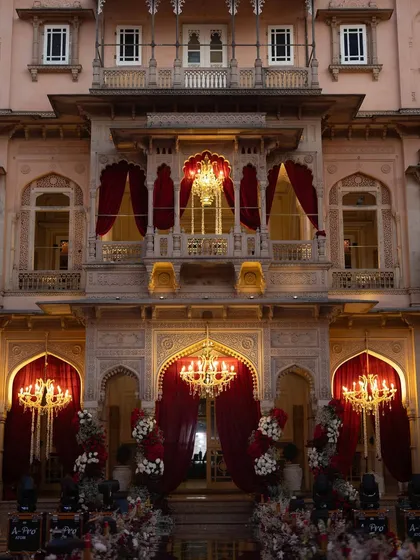 A closer view of the palace facade, adorned with opulent chandeliers and rich red drapery. This showcases our attention to detail in creating a cohesive, luxurious atmosphere.