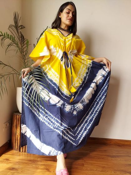 A vibrant yellow and indigo tie-dye kaftan. The bold color combination and artistic pattern make this a true statement piece for your casual wardrobe.
