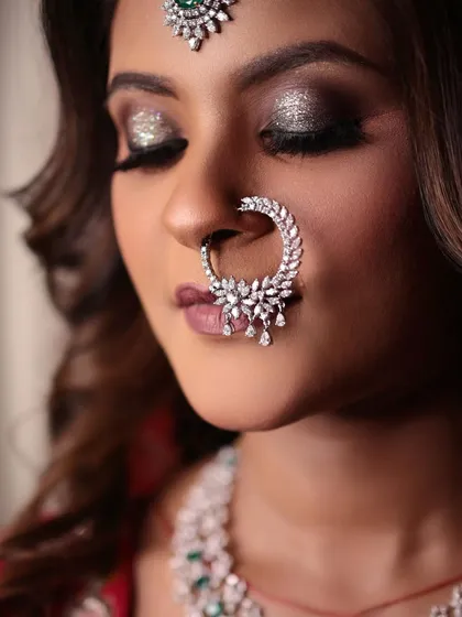 A close-up of the glittery smokey eye makeup. This dramatic look is perfect for a bride who wants to make a statement.