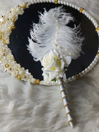 Another view of the white elegance mirror and pen. This angle shows the beautiful reflection and the delicate details of the handcrafted design.