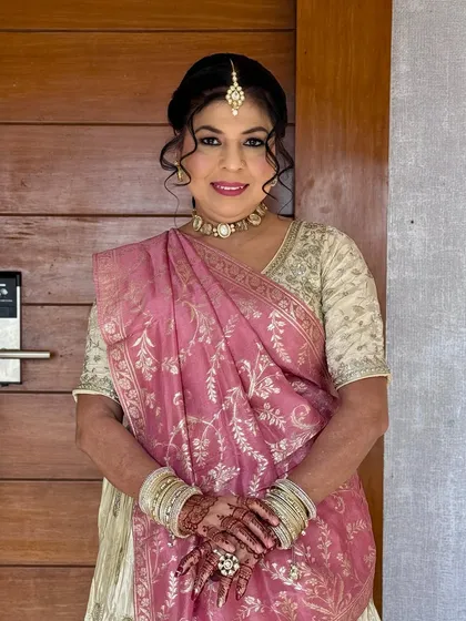 A beautiful portrait of the mother of the bride. Her makeup is elegant and age-appropriate, enhancing her natural beauty.