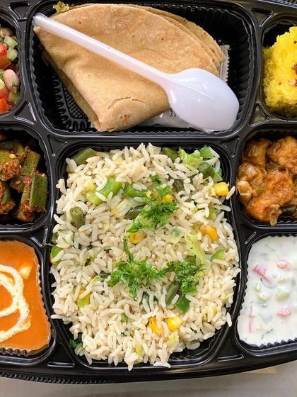 This office Diwali party meal was a hit. Each tray was filled with Veg Pulao, Paneer Butter Masala, Masala Bhindi, Khaman Dhokla, Chole, Raita, and a chapati.