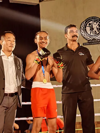 A champion's smile. Kartar Singh enjoying his victory in the ring after a dominant performance.