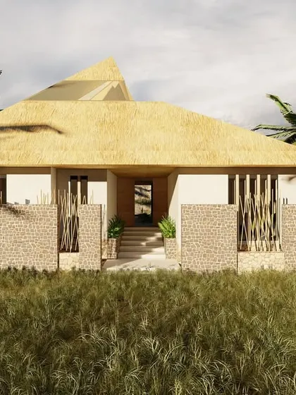 This visualization of the Serenity guesthouse shows how the structure settles into the landscape. The combination of a low profile, natural materials like stone and bamboo, and a thatch-style roof helps the building feel like a natural extension of the terrain.
