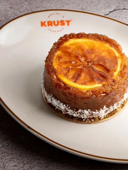 The Orange Ginger Tea Cake, a perfect single-serving treat. Its vibrant flavour and tender texture make it a delightful afternoon pick-me-up.