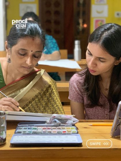 A student receives close guidance on her drawing. Our one-on-one approach ensures that every learner, regardless of their starting point, gets the attention they need to grow.