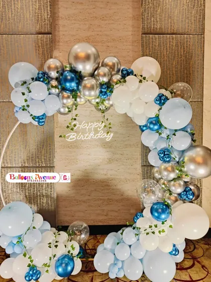 A frontal view of the blue, white, and silver balloon arch, perfect for a sophisticated birthday celebration.