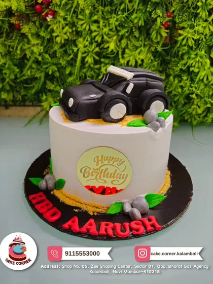 Rev up the party with this cool black SUV cake for Aarush. The fondant car on top of the cake is perfect for any young car enthusiast.