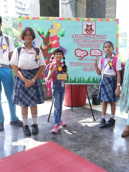 Winners of a literary competition proudly display their trophies and certificates. We encourage and reward literary talent.