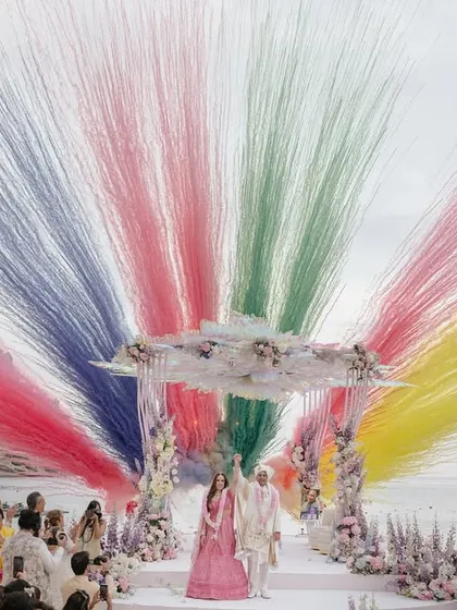 A spectacular moment of celebration as Roopali and Milap complete their pheras. The explosion of color against the serene beach backdrop in Ibiza captures the sheer joy and grandeur of a destination wedding, a story we love to tell through our lenses.