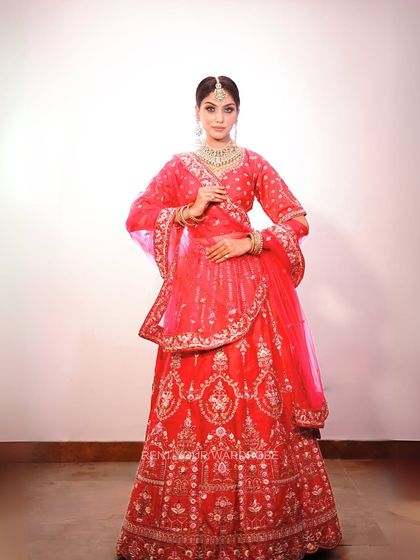 A full-length shot showcasing the grandeur of this pink bridal lehenga. It’s an ideal choice for makeup artists wanting to feature traditional wedding looks.