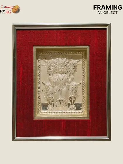 We were honored to frame this silver deity, a precious object of devotion. We chose a silver ornate frame with a rich red raw silk cloth mount to create a sacred and protected space for the artifact.