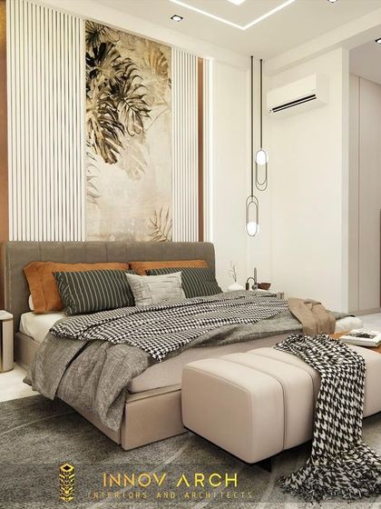 A different angle of the master bedroom in Noida Sector 19. This view shows how the natural light from the window interacts with the room's soft, elegant color palette and textures, creating a tranquil atmosphere.