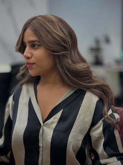 This client was hesitant about coloring her hair again after a bad experience elsewhere. We gave her this beautiful caramel brown, and her confidence was restored.