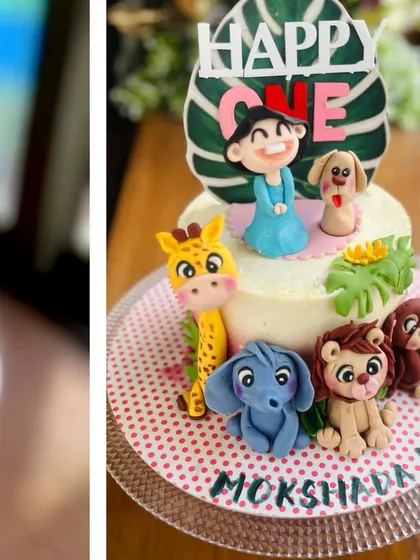 A focused shot on the cute fondant animals and the personalized topper for the jungle cake.