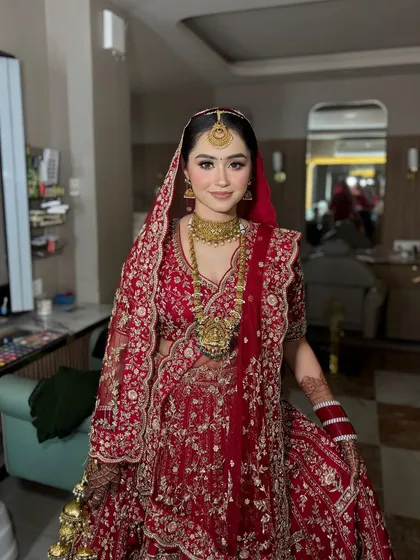 The complete look, from the beautiful lehenga to the intricate jewelry and flawless makeup. This bride is ready for her happily ever after.