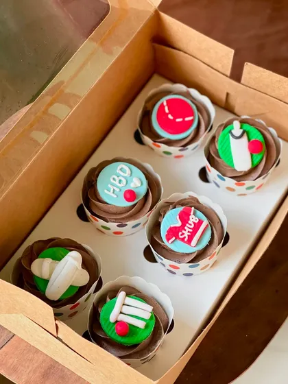 For the ultimate cricket fan. This set features handcrafted fondant toppers like a bat, ball, and wickets, all on top of my popular Nutella flavor cupcakes.