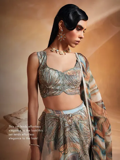 A detail shot of the Ivy Lehenga Set's blouse, where intricate embroidery creates a sense of effortless elegance and modern luxury.