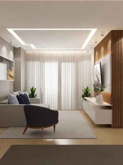 A minimalist living room with a comfortable sofa and a sleek TV unit. The design is perfect for creating a serene and uncluttered living space.